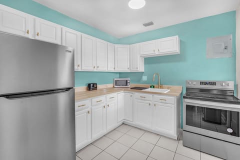 Kitchen has ample sized kitchen counters which offers a generous surface area to accommodate multiple tasks for meal preparations.