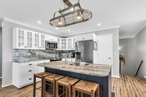 Gorgeous Kitchen has Gleaming Granite and Stainless Steel Appliances.