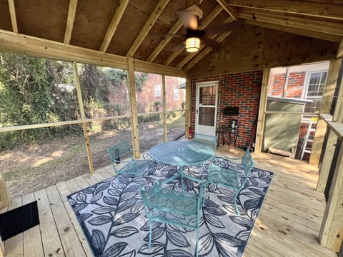 Welcome to our private fenced yard with screened porch, grill, and fire pit area