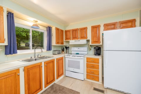 Spacious and fully furnished kitchen with modern appliances