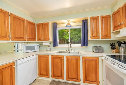 Spacious and fully furnished kitchen with modern appliances