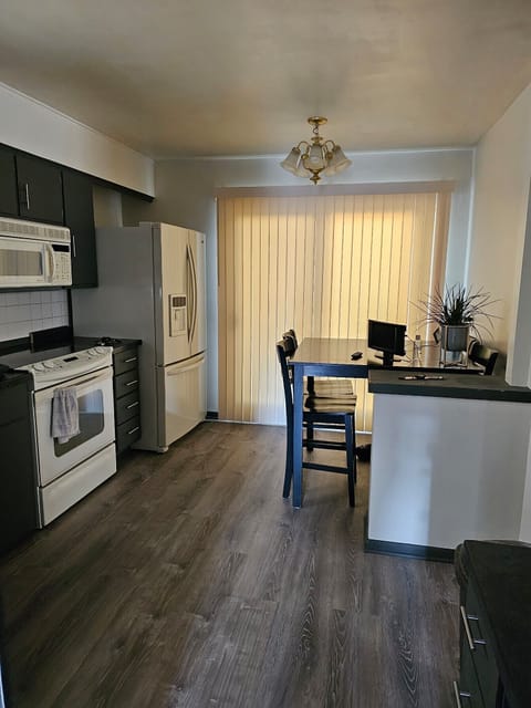 Kitchen patio door to deck and backyard
