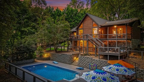 The multi-level decks and sparkling pool offer endless ways to enjoy the peaceful riverside setting.