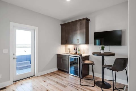 Top floor wet bar area that leads to the rooftop patio.