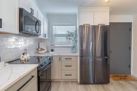 High end appliances and stunning quartz countertops will delight the chef of the family!