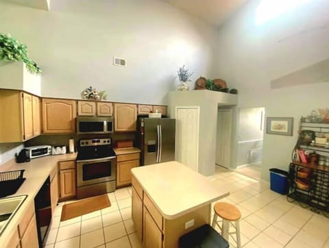 Stainless steel appliances, central island, and large pantry