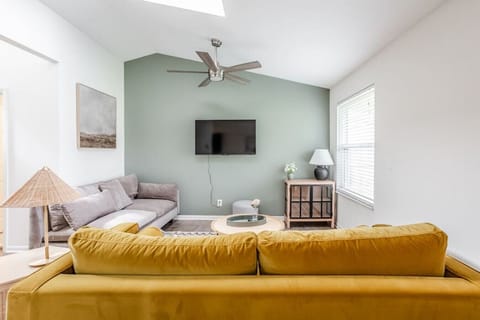 Comfortable, deep seating couches and 50" Smart TV