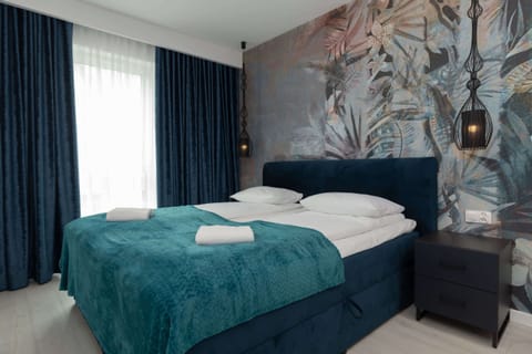 Comfortable double bed in the bedroom. 
