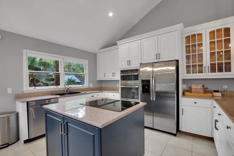 Kitchen featuring new stainless steel GE  & Kitchenaid appliances