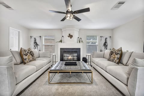 Relax with large cushioned couches in the luxurious family room downstairs. 