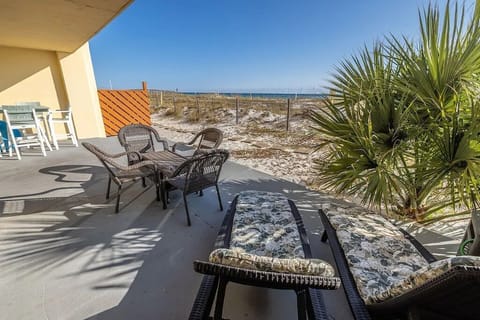 Surf Dweller #111 Patio - Private patio! Raised table / 4 chairs, 2 loungers, seating for 4, & baby pool.