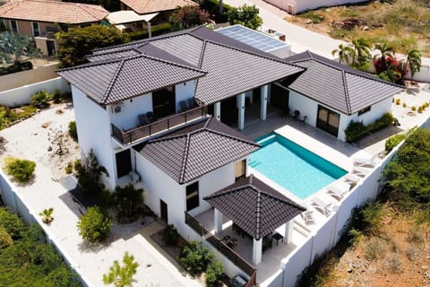 In the prestigious neighborhood of Kamay, you will find this stunning 2-story villa offering 3 ensuite bedrooms, perfect for threecouples, and 4 full bathrooms plus an upstairs “sunset suite”.