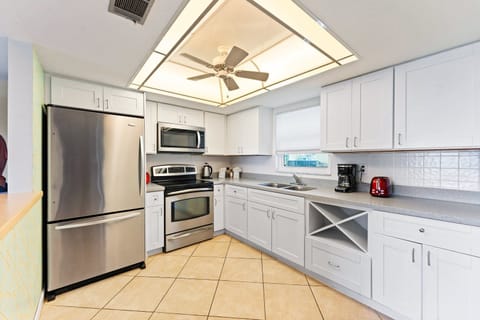 A bright, fully equipped kitchen makes cooking effortless and enjoyable.