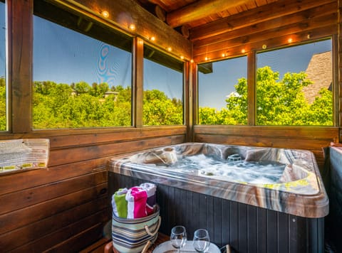 Enjoy a private outdoor hot tub on the screen-in porch!