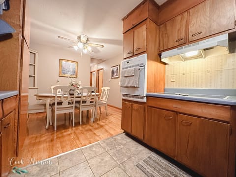 Kitchen w/ microwave, toaster, pots, pans, dishes, utensils, dishwasher & more.