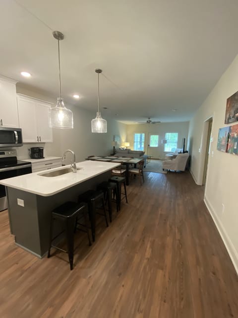 Open floor plan. Dining room table with extension. Seating for eight. 