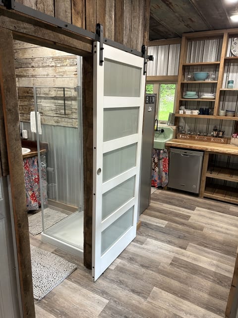 Sliding barn door on bathroom.
