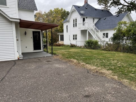 Backyard area with covered patio.