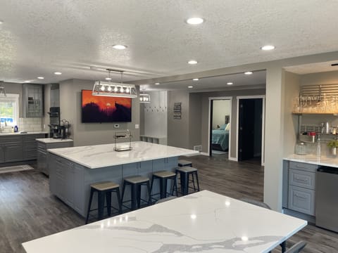 Overlooking dining room table & kitchen island, kitchen to the left.
