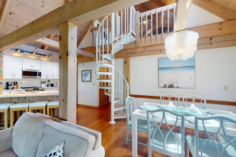 The spiral staircase is a beautiful feature of this tastefully decorated condo