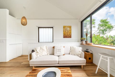 Living room with sliding windows opening up fully to the outside
