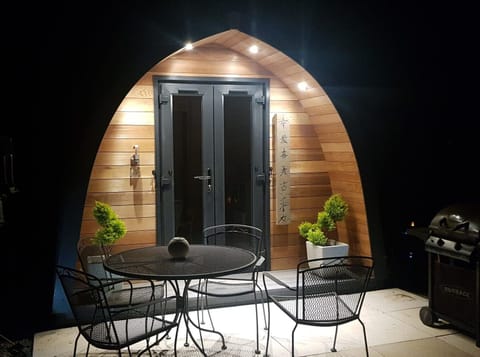 A lovely lit patio patio area to enjoy a drink on warm summers night.