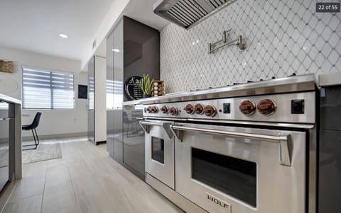 Kitchen features a 60" Wolf range