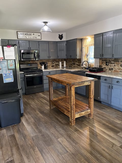Large open kitchen with stainless steel appliances 