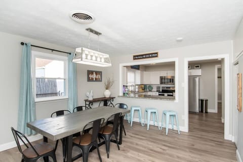 The dining room seats six comfortably, perfect for family meals or gatherings.