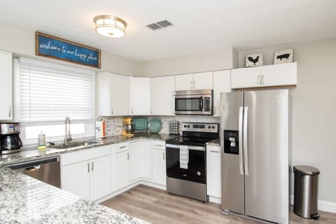 Remodeled large kitchen with granite countertops and stainless appliances