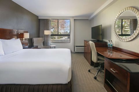 Unwind in a crisp, spacious room with dedicated workspace.