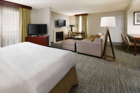 Stretch out in your suite with lounge seating and workspace.