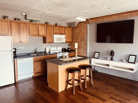 Full Kitchen with Stove/Oven, Dishwasher and Refrigerator/Freezer;
