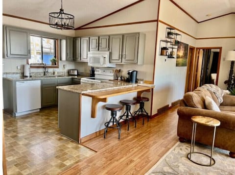 View of kitchen area with casual bar stool area 