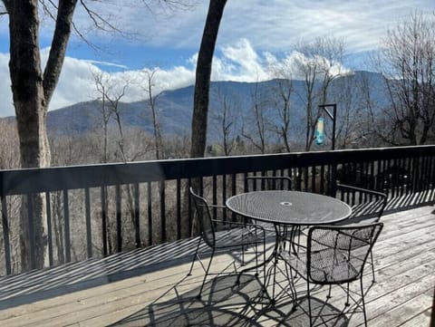 Upper level deck with table/chairs, hammock and added conversation chair area
