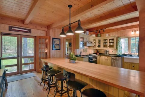 Screened doors leading to backyard. First floor full bathroom just off kitchen.