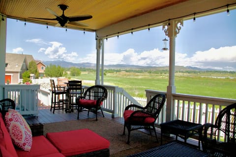 Covered porch w/ fans & outdoor speakers. View of Longs Peak & Lake McIntosh.