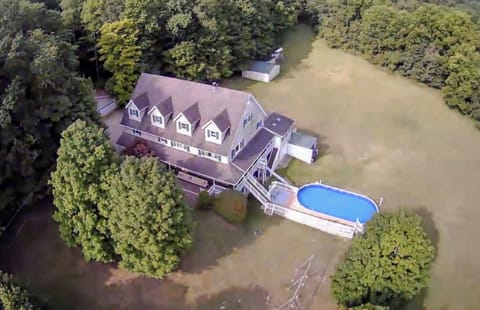 Drone photo of the peaceful and private 11 acres. 12 beds, 7 baths home.