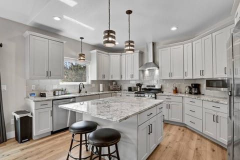 Stocked Kitchen with Drip Coffee Maker, Coffee, Creamer, Sugar, Tea, Tin Foil, and More.