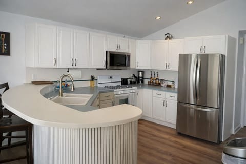 Clean, modern kitchen with stainless steel appliances and ample counter space