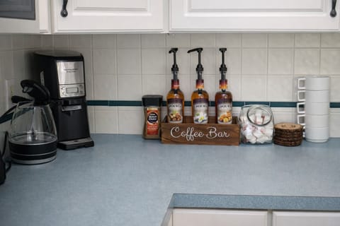 Coffee bar with syrups, creamers, and essentials ready to go.