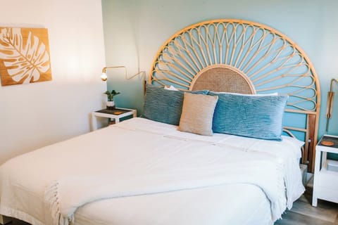 King bed with luxury sheets. 