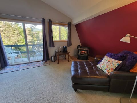 Upstairs bedroom with gas fireplace.