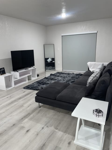Living room, tv and access to balcony