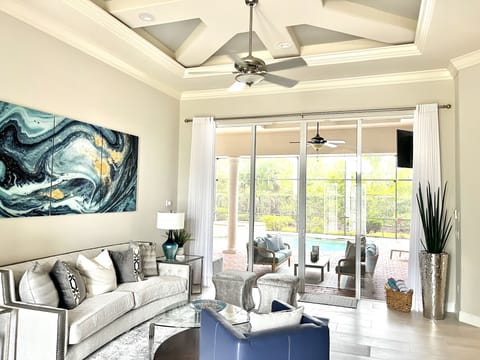 Fabulous great room w volume ceilings. Direct access to the pool and spa.