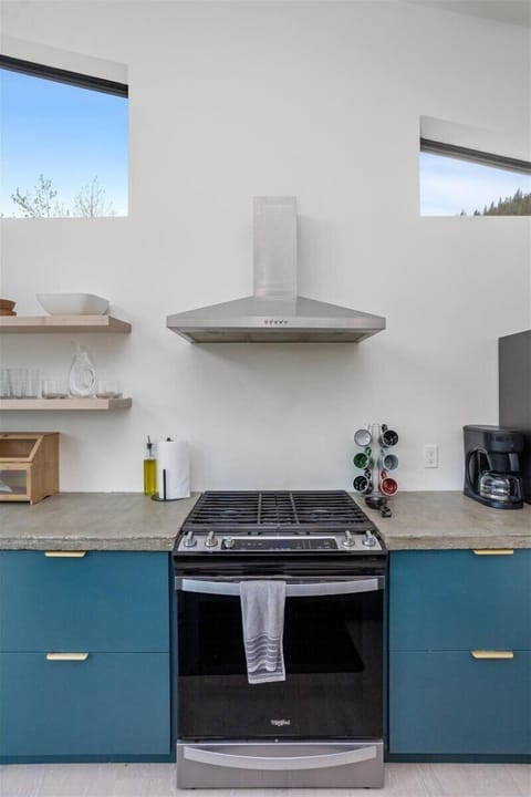 Full stove and oven for cooking in meals for the group.