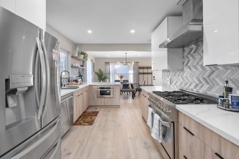 The fully equipped gourmet kitchen awaits you to fulfill your culinary desires. 