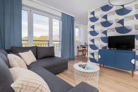 Relax in the stylish living room with a comfortable sofa and modern decor.