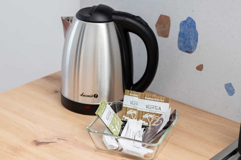 The sleek design of the kitchenette blending seamlessly with the living area.