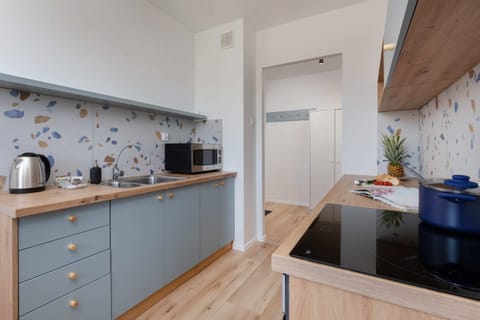 The fully equipped kitchenette includes everything you need for a home-cooked meal.